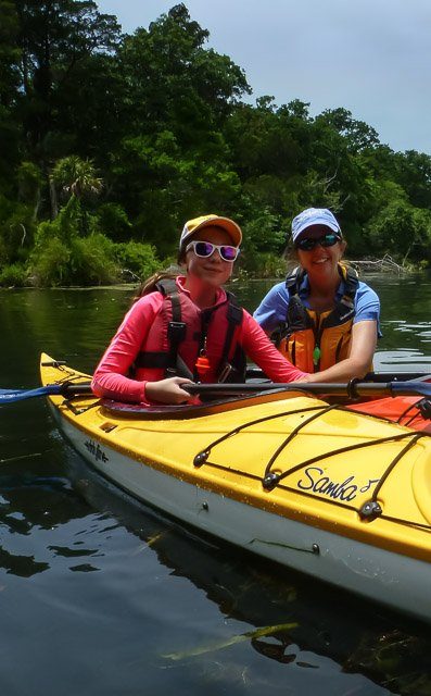 Kim in her fathom kayak and Delaney in her samba eddyline kayak